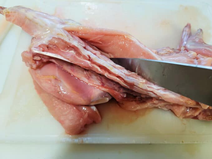 Butchering the loin from the rabbit carcass.