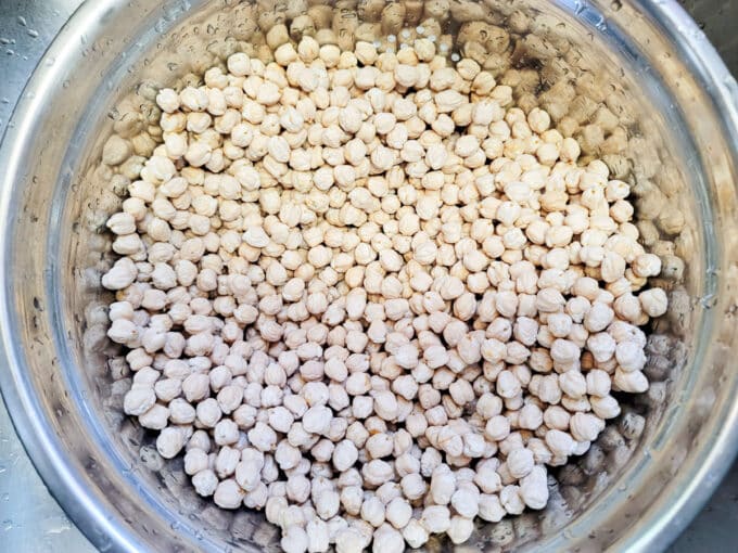 Dried chickpeas in a colander.
