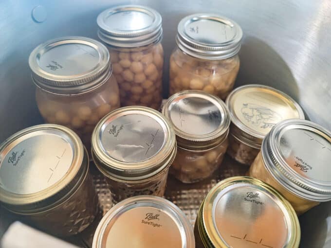 Canning pot filled with 2 layers of jars.