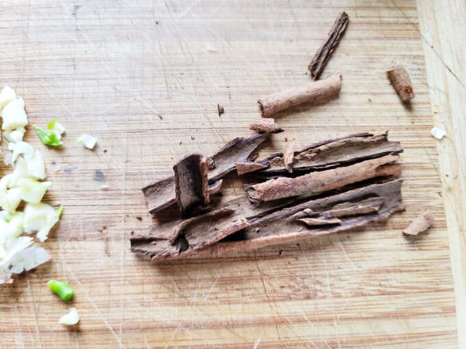 Crushed cinnamon on cutting board.
