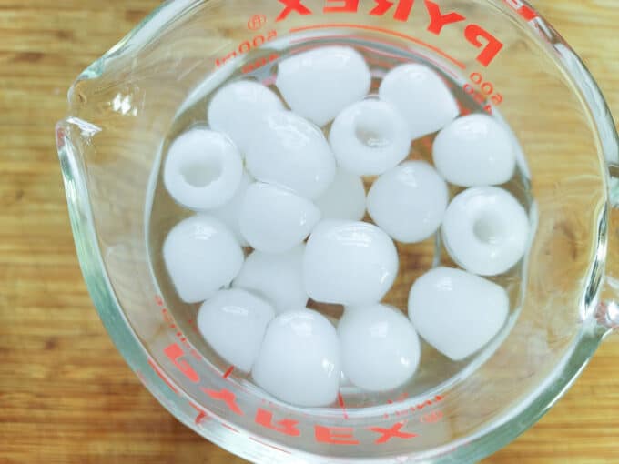Water and ice in a measuring cup.