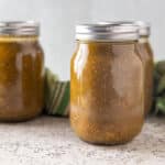 Green tomato sauce in jars.