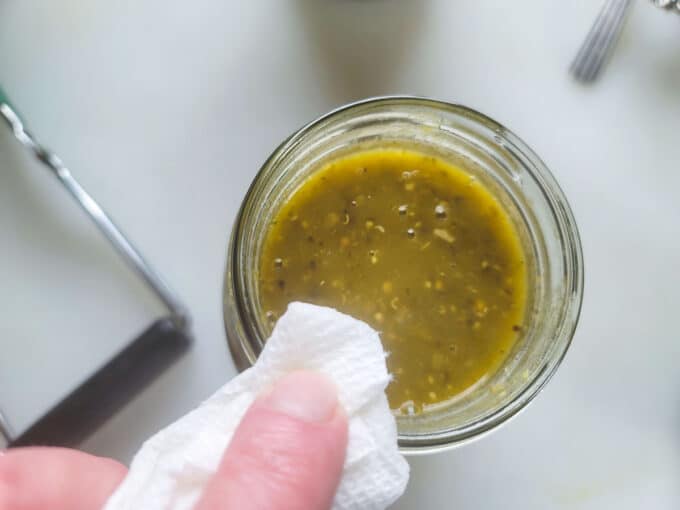 Wiping the jar rim.