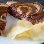Corned Venison Reuben on marble rye bread.
