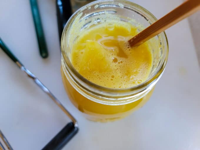 Removing air bubbles with a wooden chopstick.