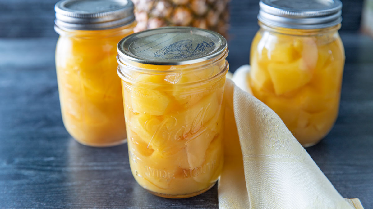 Jars of canned pineapple chunks.