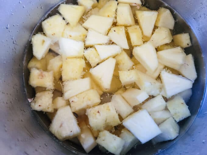 Add pineapple to a large pot. Barely cover with water.