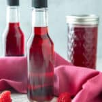 Decorative bottles of raspberry vinegar.