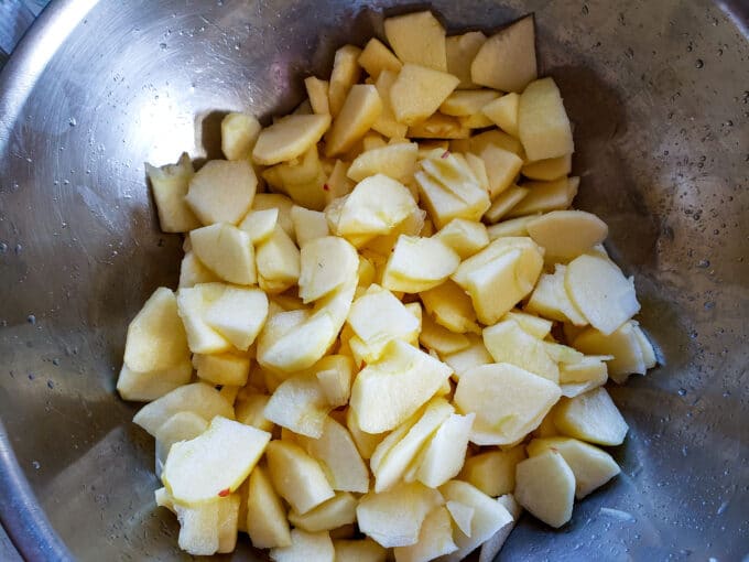 Apples in a metal bowl.