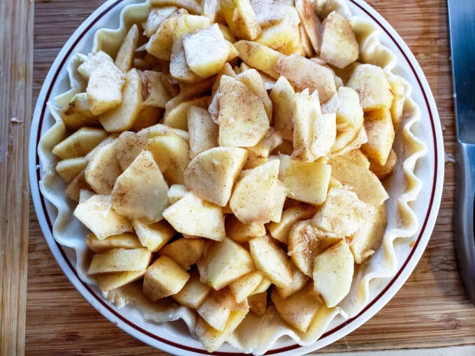 Apples added on top of pie crust.