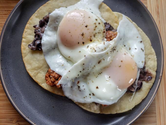 Eggs placed on top of the meat.
