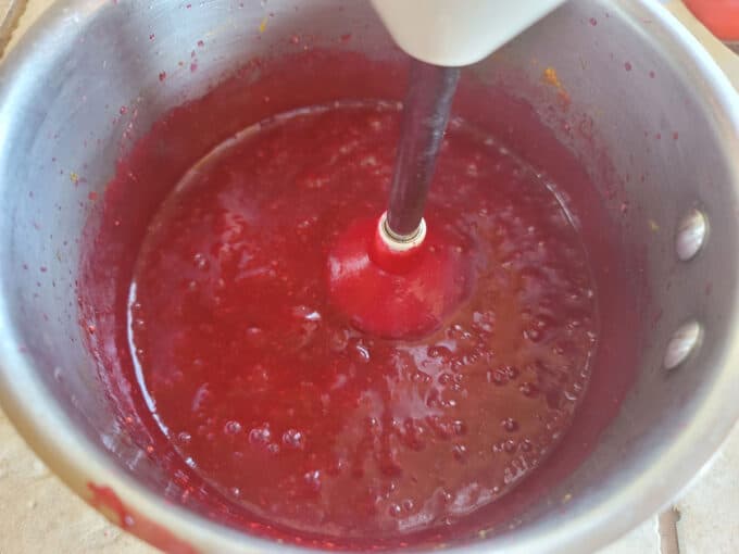 Pureeing butter with immersion blender.