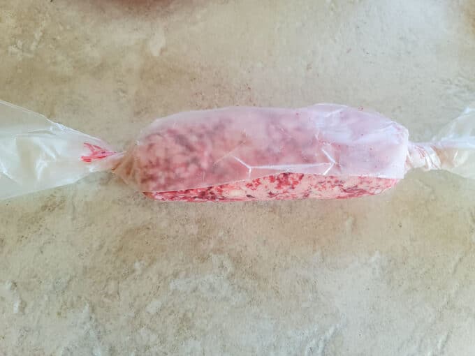 Flavored butter wrapped into a log shape in waxed paper.