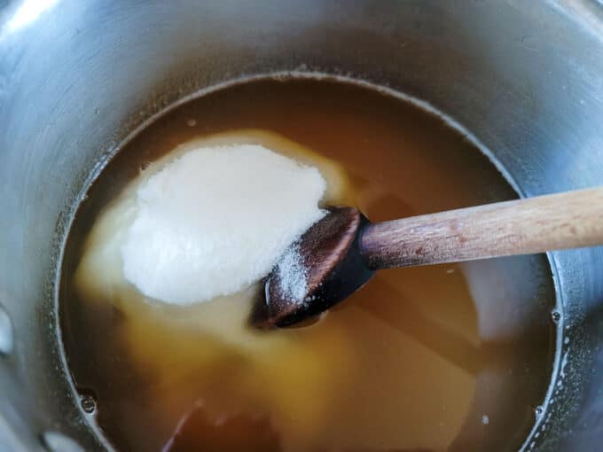 Sugar added to boiling tea.