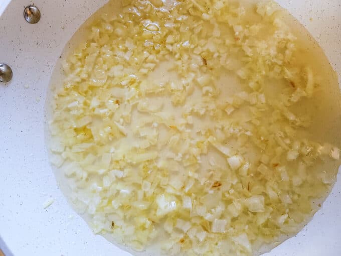 Broth added to skillet.