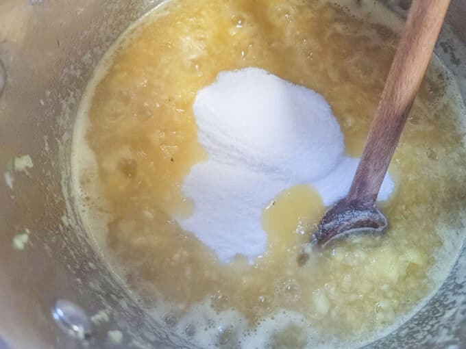 Sugar added to boiling fruit.