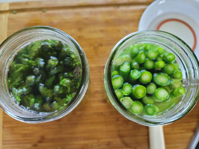 Jars packed with asparagus.
