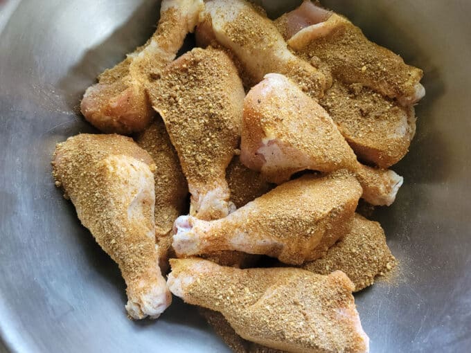 Rub sprinkled on top of drumsticks.