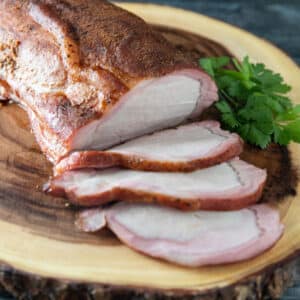 Sliced smoked pork loin with smoke ring.