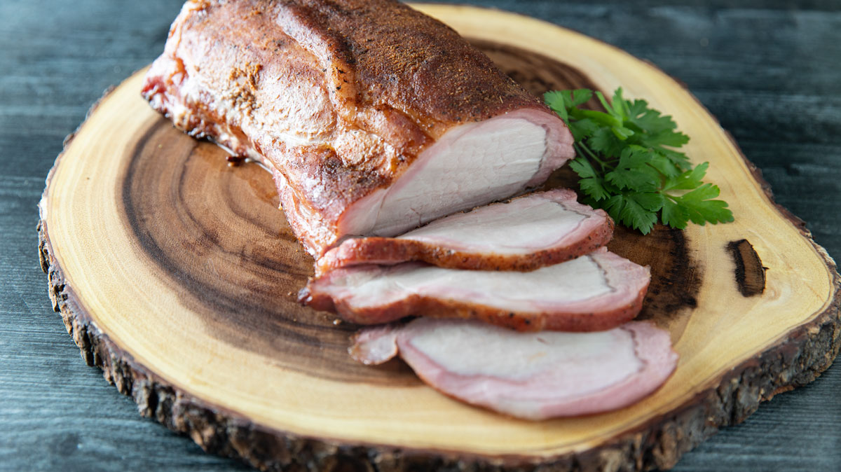 Sliced pork with lovely smoke ring.
