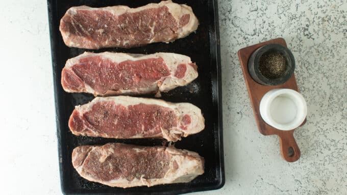 Ingredients for smoked steak. Salt, pepper and steaks.