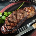 Seared steak with hashtag grill lines.