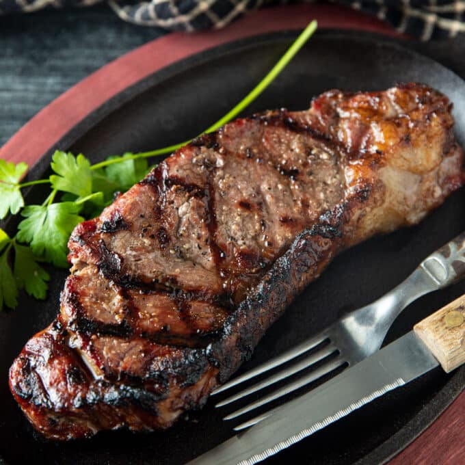 Seared steak with hashtag grill lines.