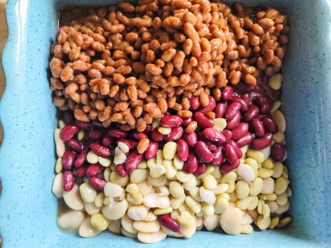 Beans added to a casserole dish.