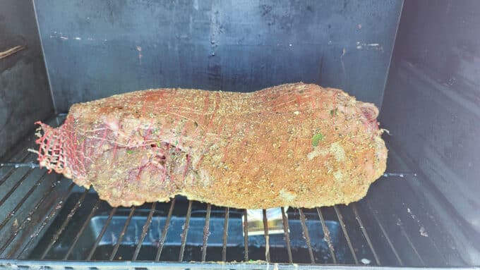 Place the lamb leg directly onto the grill grates or smoker rack.