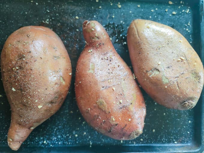 Potatoes sprinkled with salt, pepper and garlic.