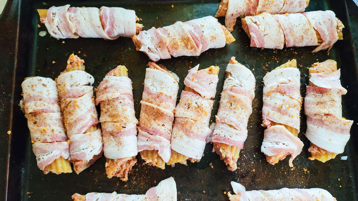 Bacon wrapped shells sprinkled with dry rub.
