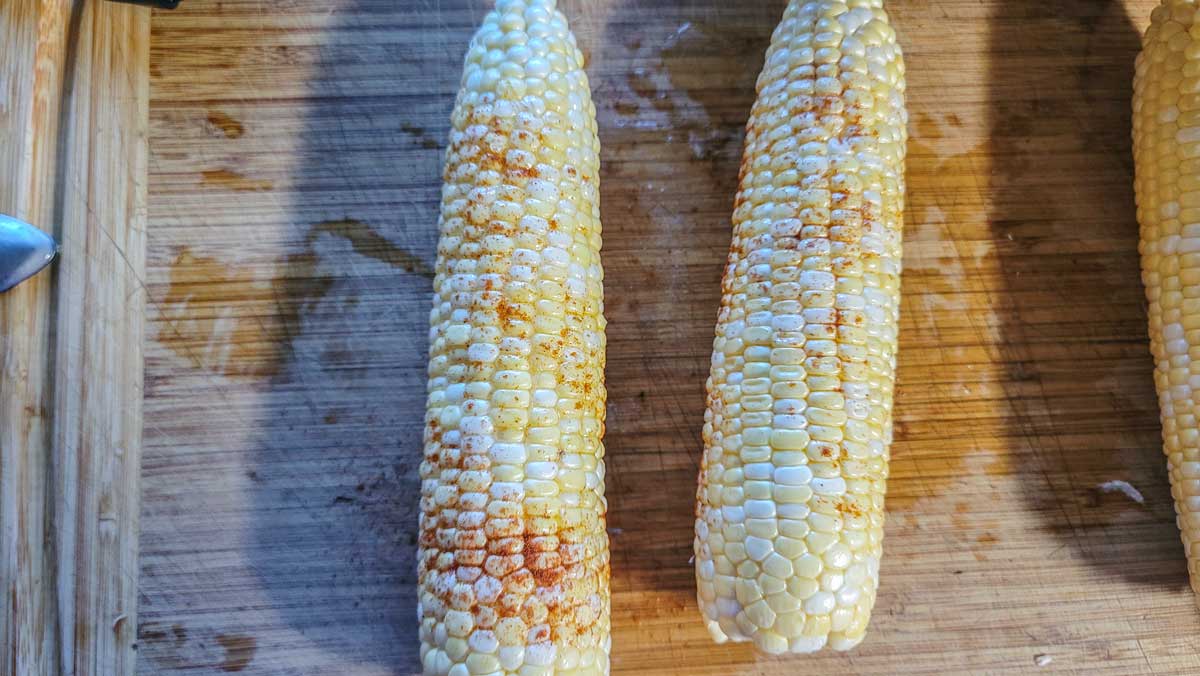 Buttered corn sprinkled with paprika.