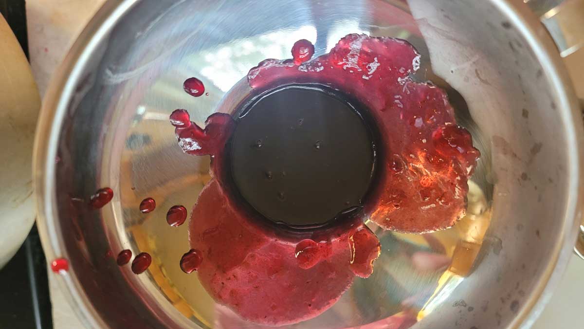 Filling a jar with a canning funnel