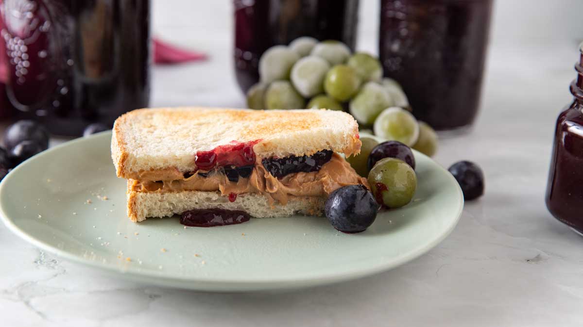 Peanut butter and grape jelly sandwich assembled.
