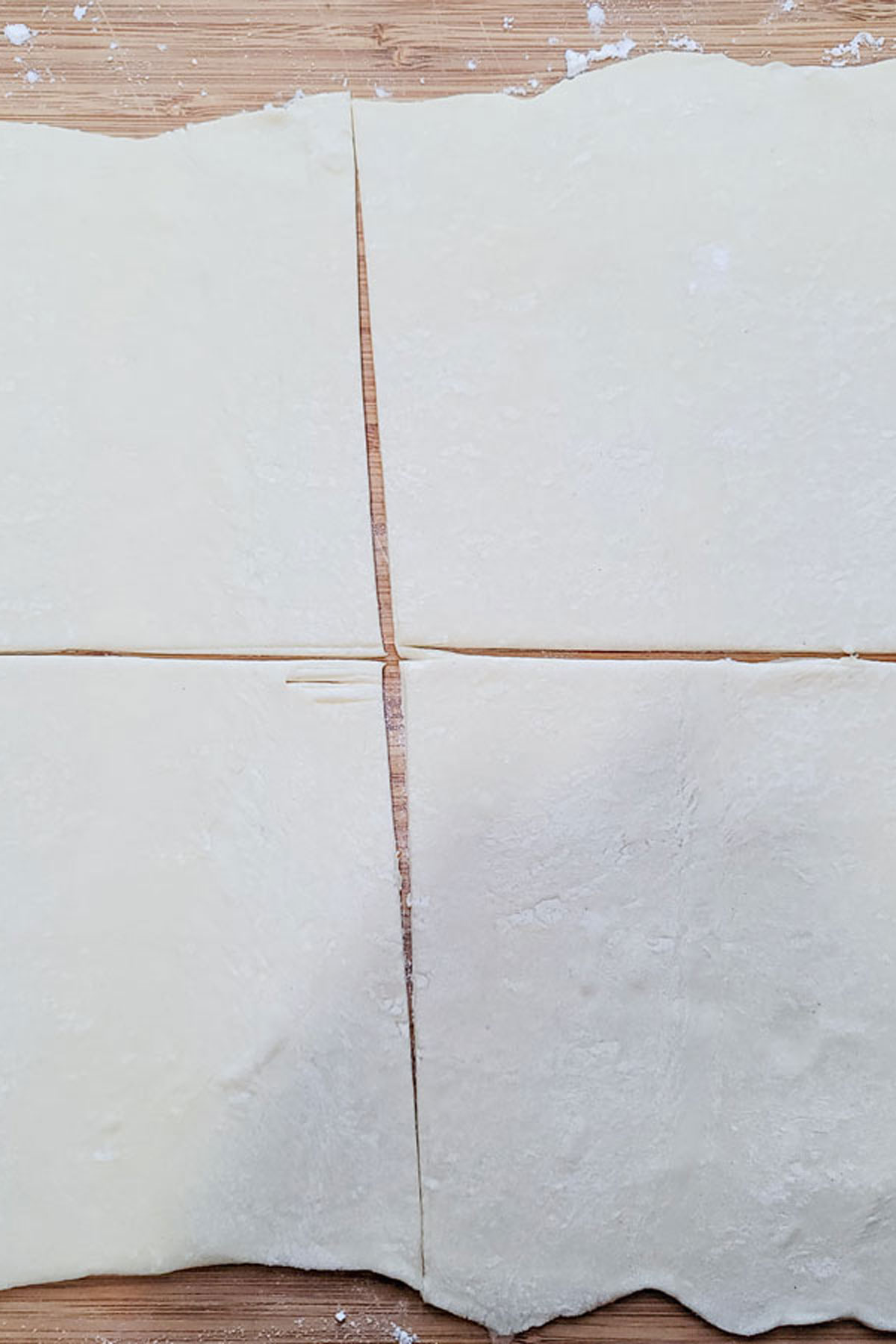 Puffed pastry sheet cut into four equal pieces.