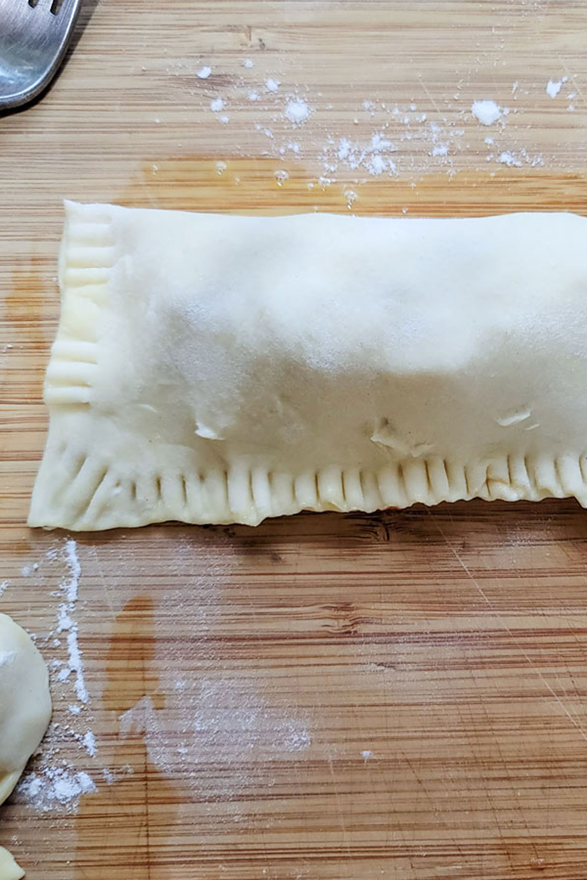 Folded hot pocket with crimped edges.