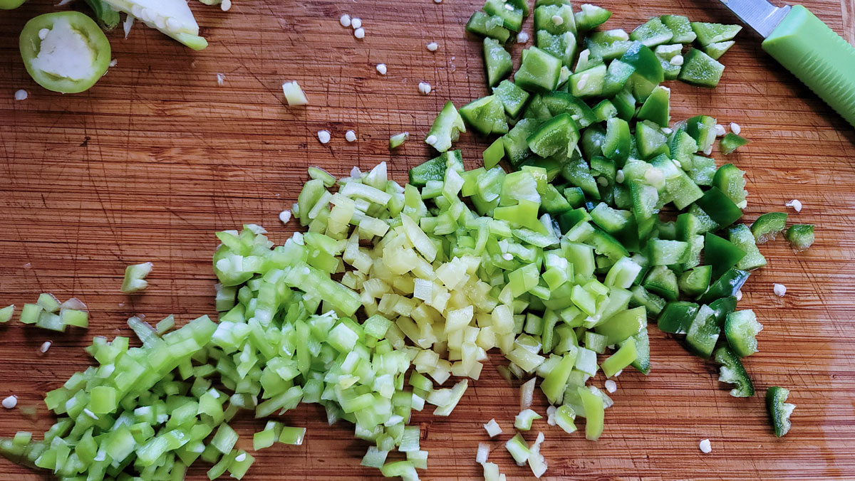 Chopped peppers on a cutting board.
