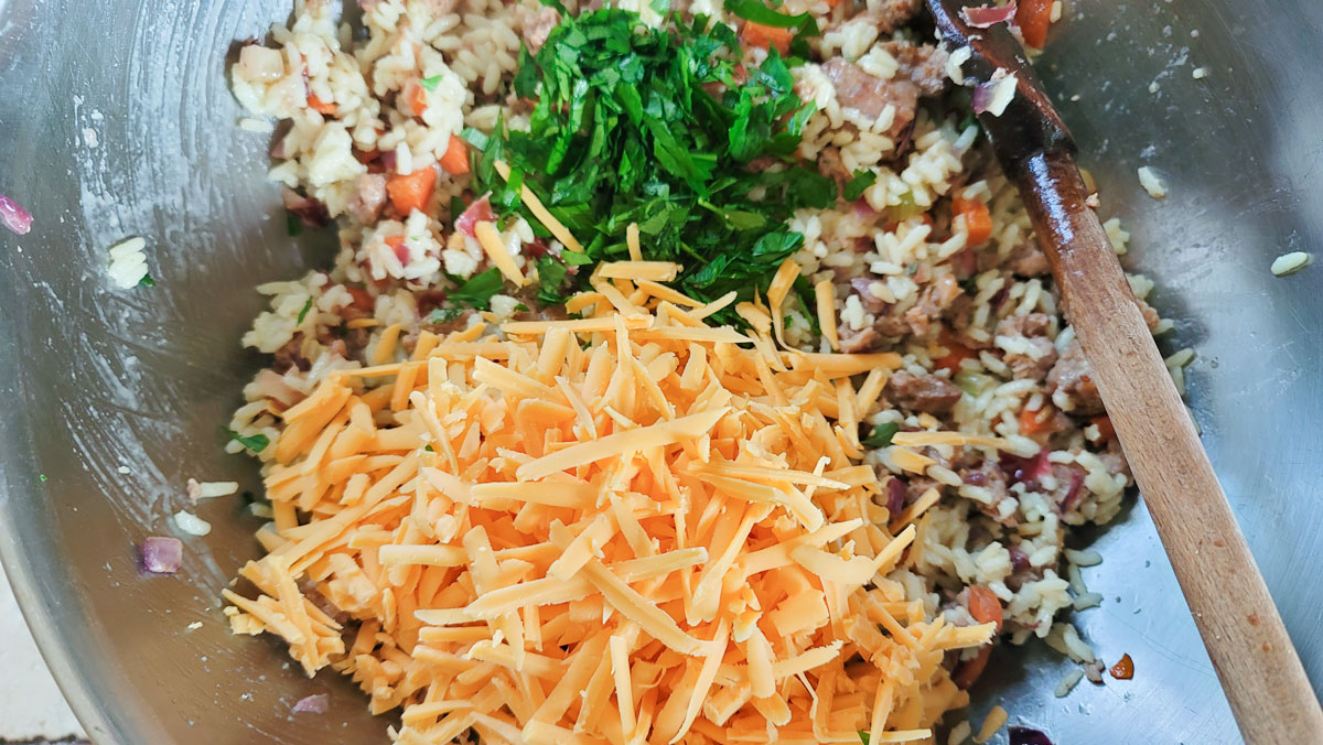 Herbs and cheese added to the rice mixture.