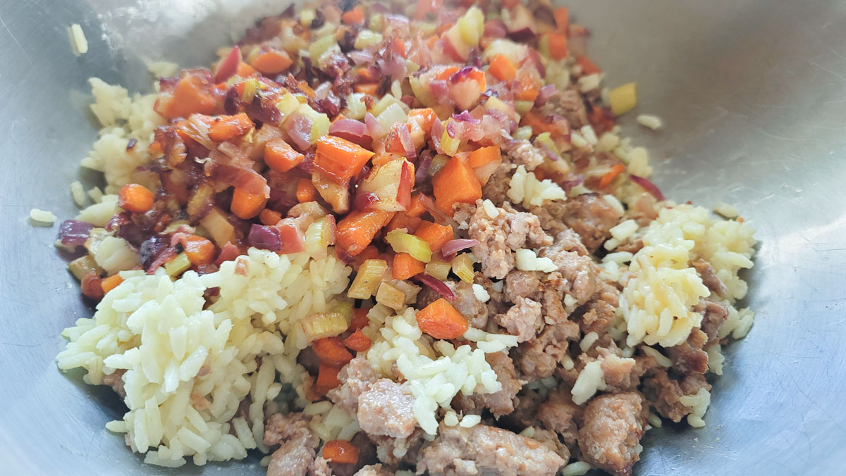 Mix the cooked rice, sausage and softened vegetables in a large bowl.