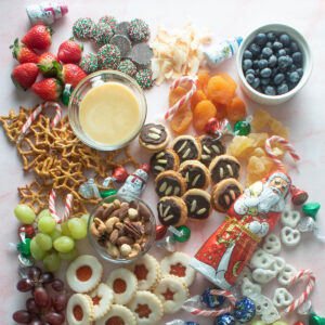 Assorted sweets on a pink board.