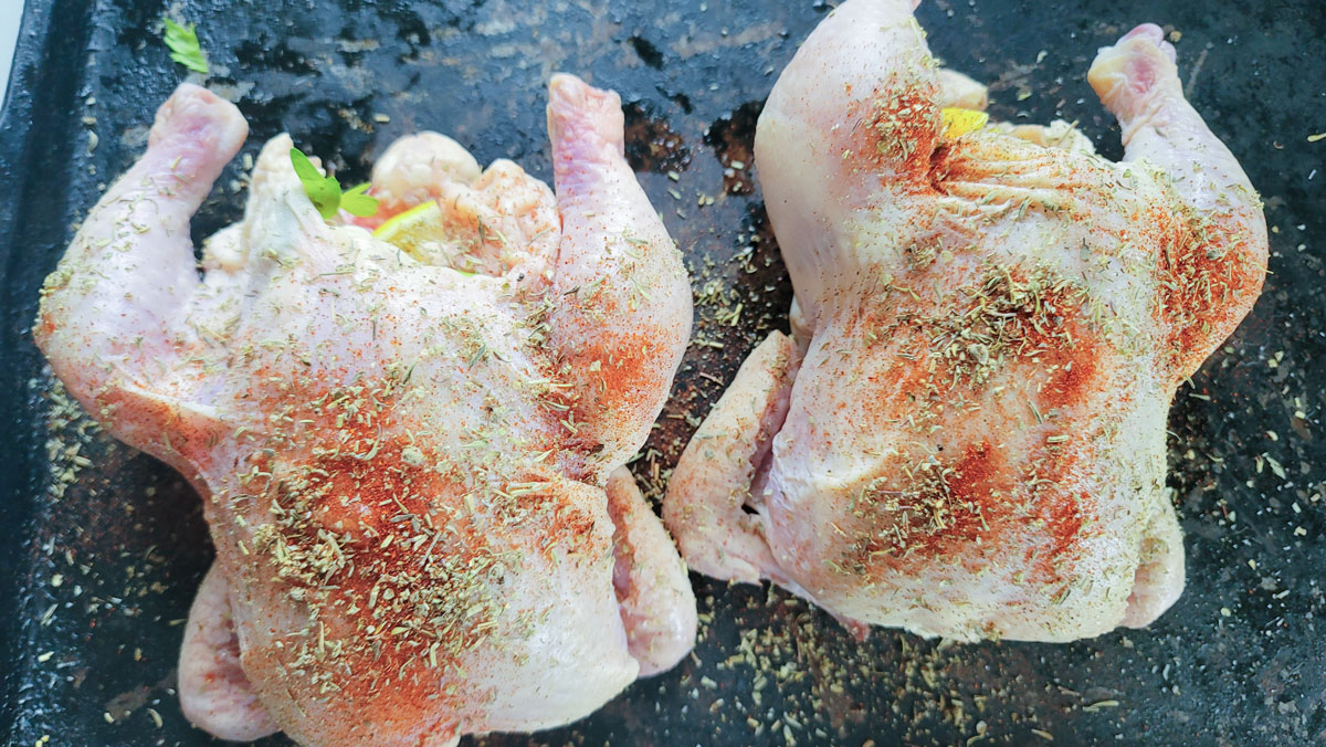 Hens stuffed with vegetables and seasoned with the dry rub.