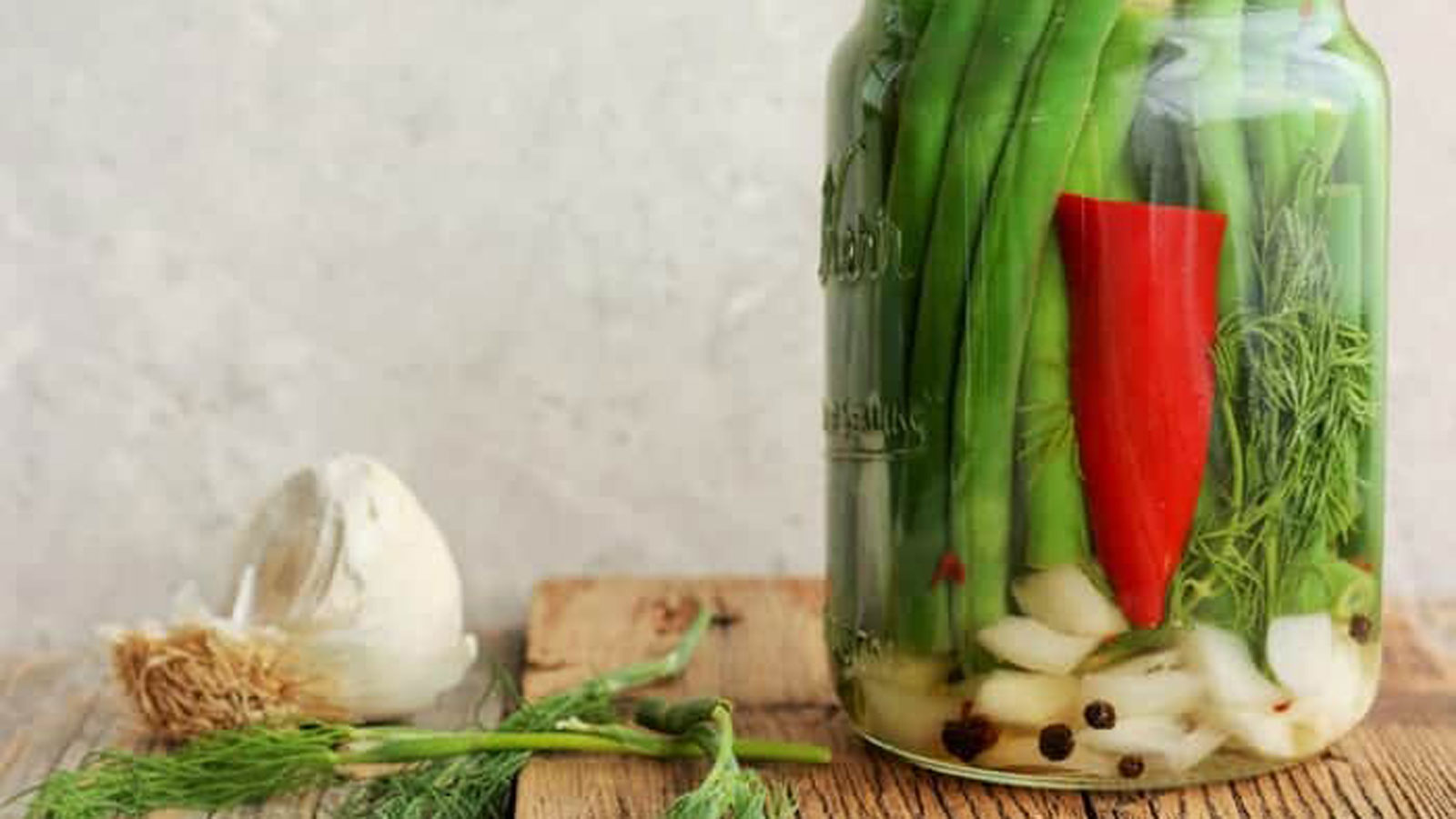 Dill pickle green beans in a jar.