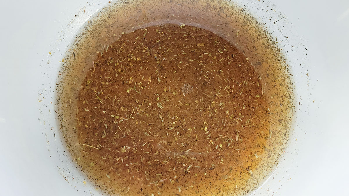 Marinade mixed up in a medium bowl.
