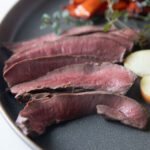 Close up of seared, sliced deer heart.
