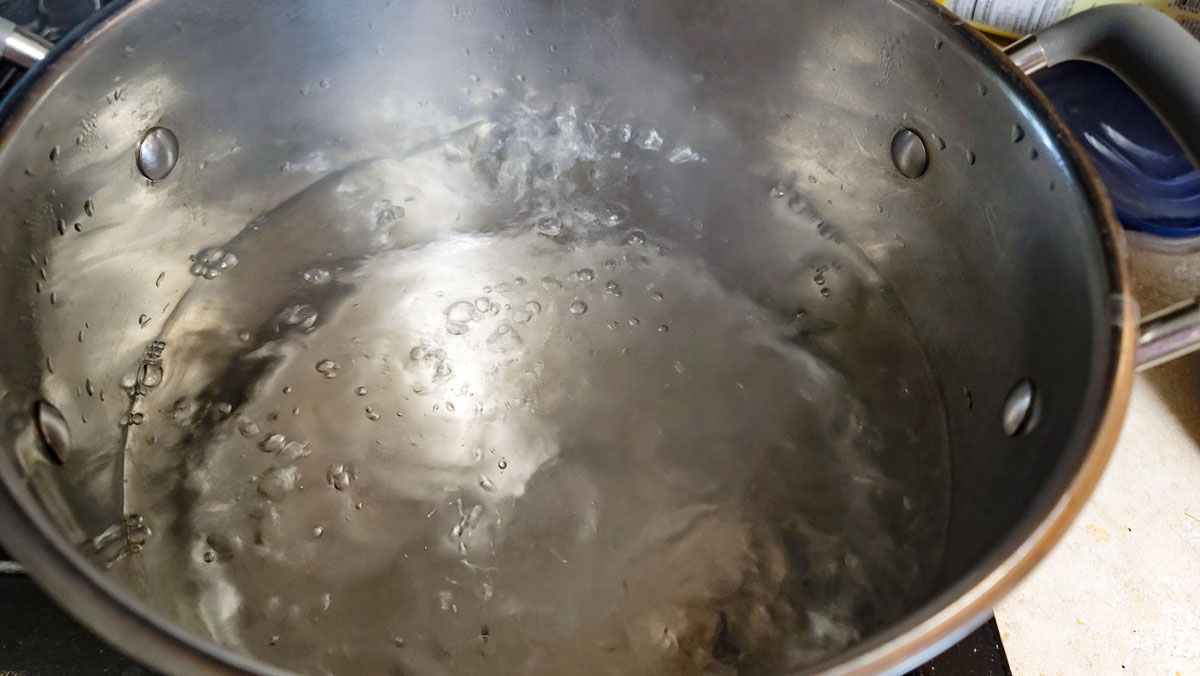 Boiling water to blanch the cauliflower in.