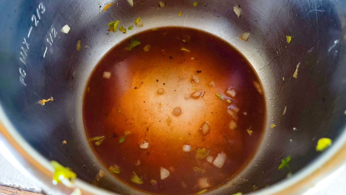 Pot being deglazed with wine.