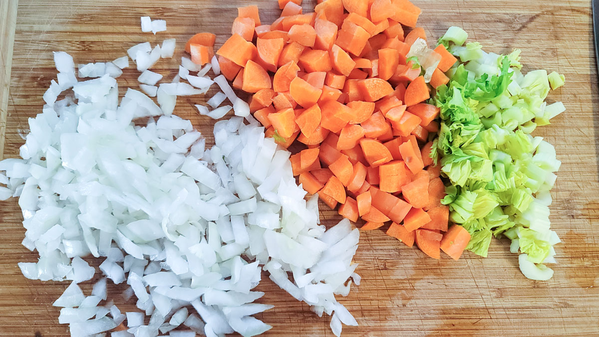 Chopped vegetables on a wooden board.