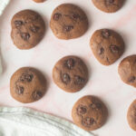 Molasses cookies on a pink background.