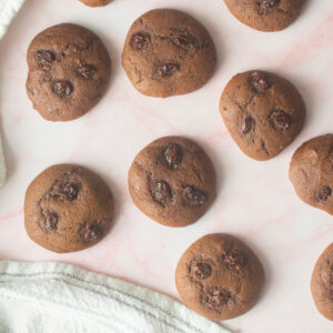 Molasses cookies on a pink background.