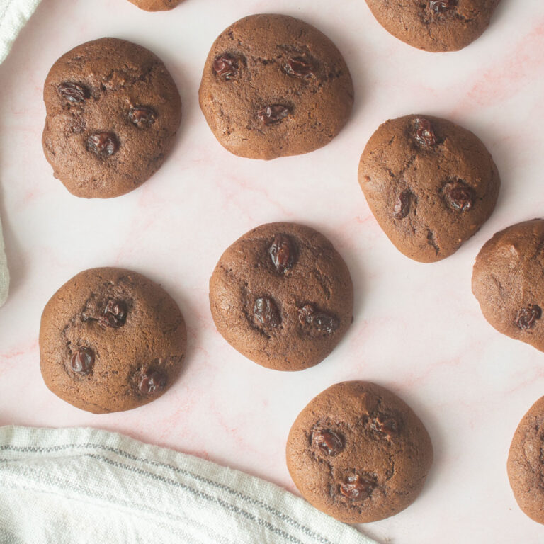 Molasses cookies on a pink background.